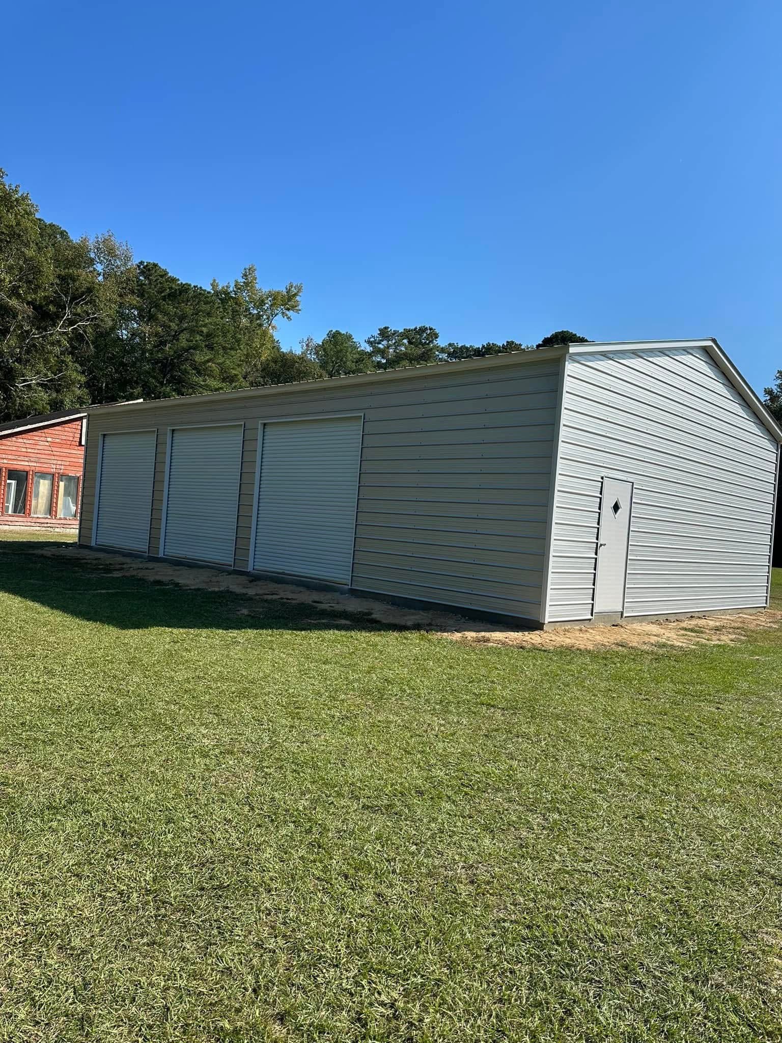 Large metal building with multiple roll-up doors