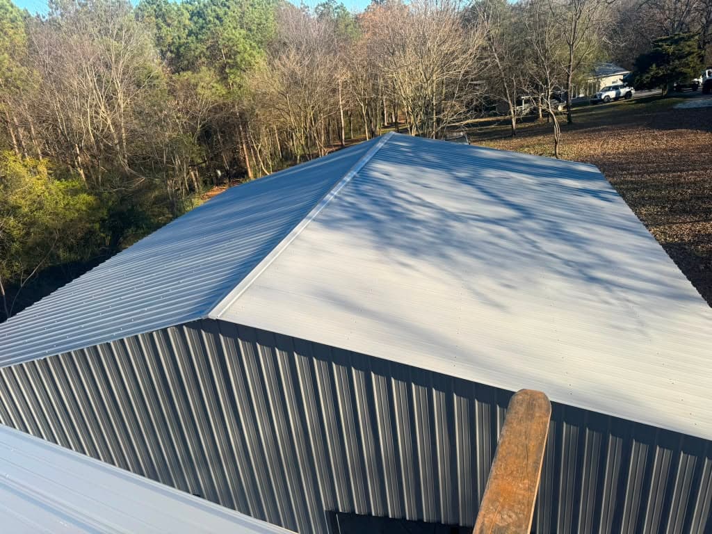 Close view of a Frontier steel building's metal roof panels and ridge