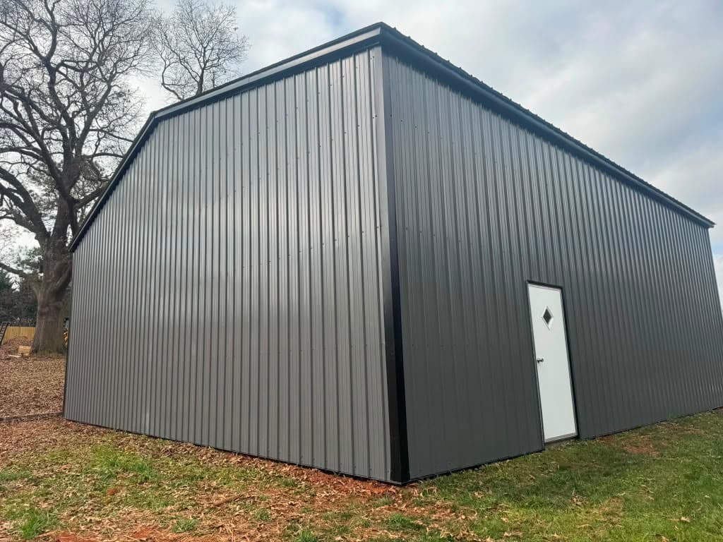 Black 30x80x14 metal garage — side angle